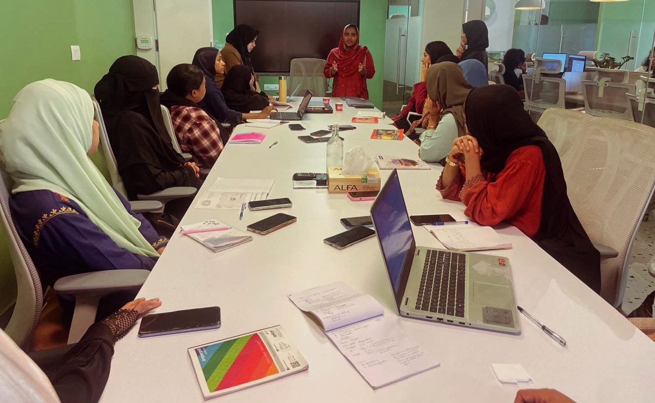 Scholars discussing in academic seminar